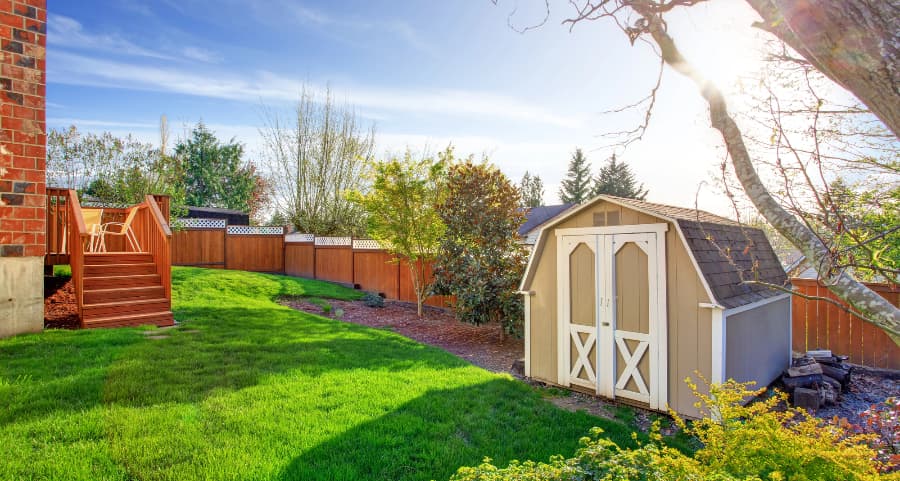 Fenced backyard with storage shed in Trenton